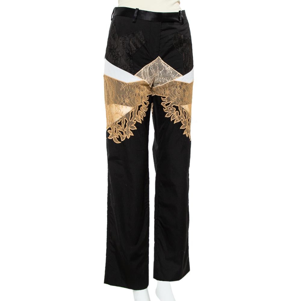 Tailored seamlessly, this pair of pants from Givenchy will give you a wonderful fitting. The cotton & lace pants are fashioned with zip closure and two pockets. They come in a black hue and have a straight-leg silhouette. Pair it with a fitted shirt