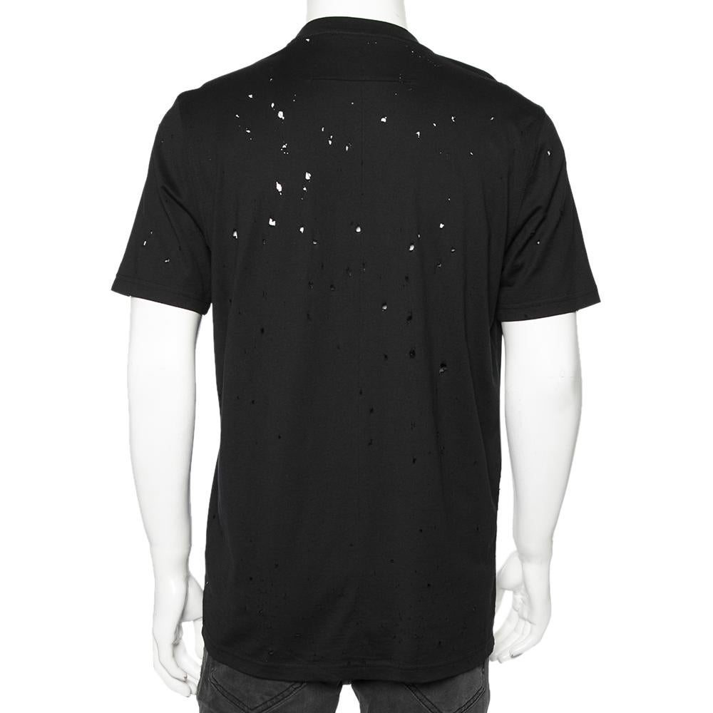 Let your casual styles be full of luxury and class! With this T-shirt from the House of Givenchy, you will obtain a suave style without compromising on comfort. It is made from black distressed cotton fabric, with a logo print adorning the front. It