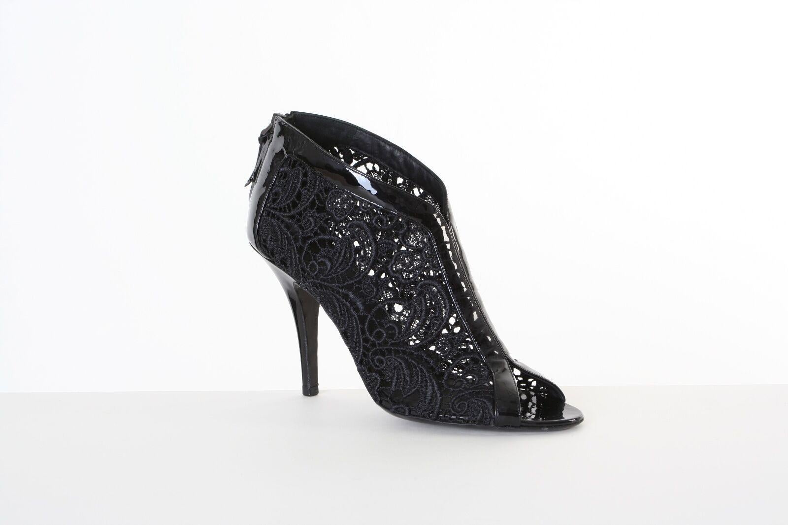 GIVENCHY black floral lace patent leather peep toe booties heels EU37.5 US7.5
GIVECHY by RICCARDO TISCIBLACK FLORAL LACE . 
PATENT LEATHER TRIMMING . 
PEEP TOE . 
COVERED HEEL . 
ZIP BACK CLOSURE WITH RIBBON PULL . 
STILETTO HEEL . 
BOOTIES . 
MADE