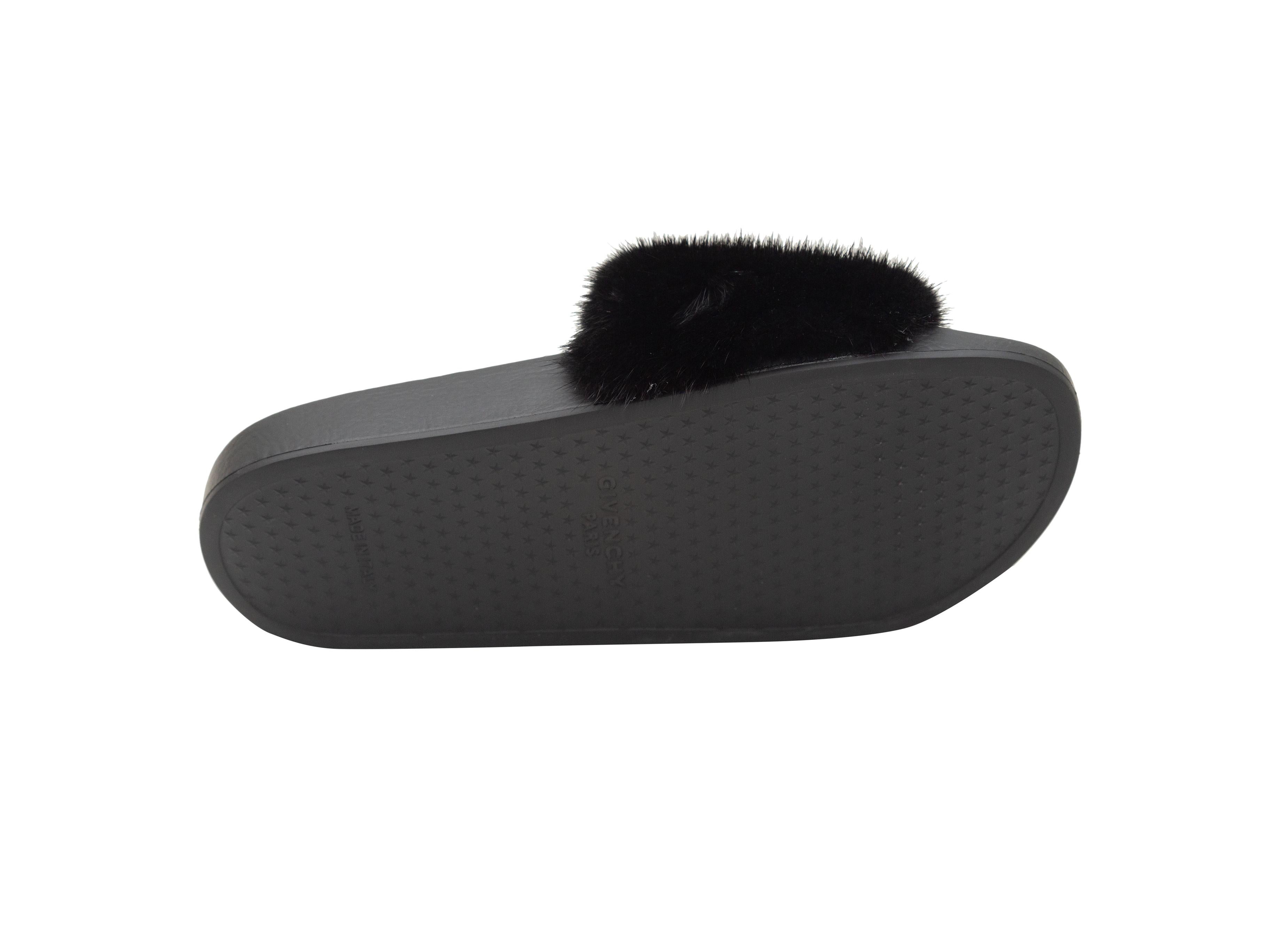 Product details: Black fur and rubber slide sandals by Givenchy. Designer size 37. 1