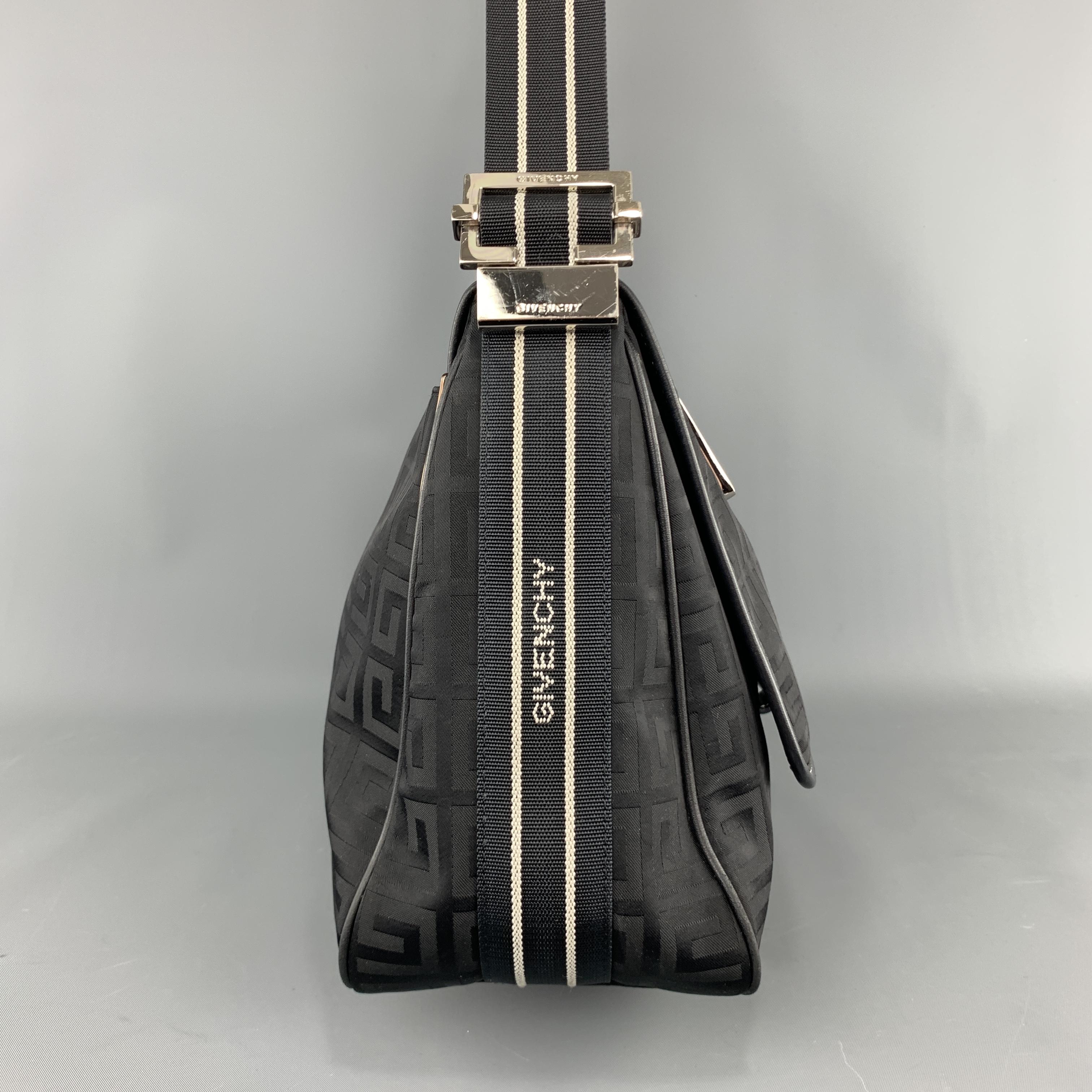 GIVENCHY shoulder bag comes in GG monogram nylon with leather piping, flap with magnetic closure, silver tone zipper, and logo webbing strap. 

Excellent Pre-Owned Condition.

Measurements:

Length: 16 in.
Width: 5 in.
Height: 10 in.
Drop: 15 in.