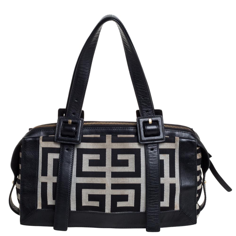 Make everyone nod in approval when you step out swaying this fabulous satchel from Givenchy. It has been crafted from the signature monogram canvas and leather and styled with buckle detailed dual top handles. It opens to a spacious interior that