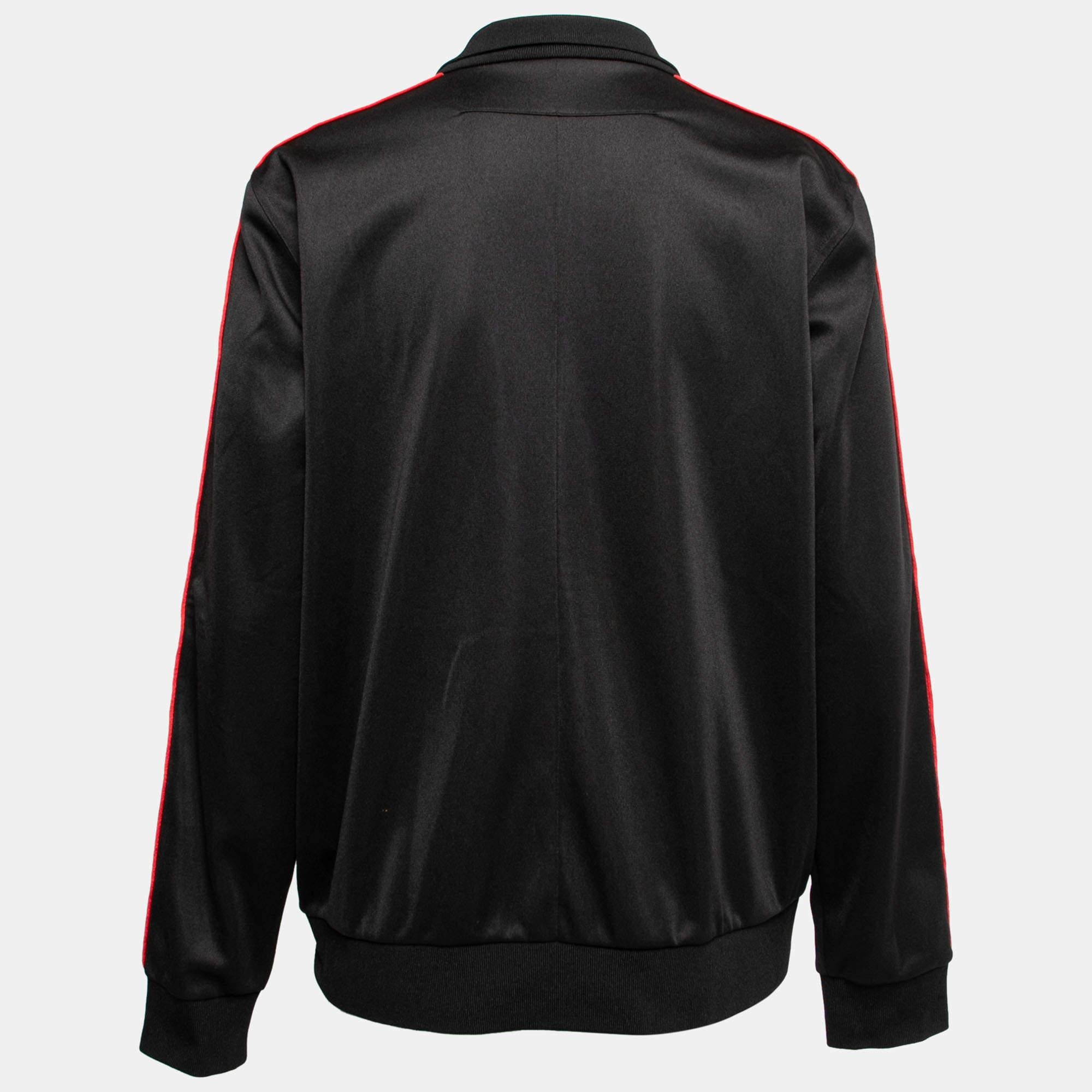 Sport an effortlessly dapper look with this jacket from the House of Givenchy. It is tailored using black jersey fabric, with logo tape trims highlighting its long sleeves. This jacket has a zip-front fastening, collars, and two external pockets.