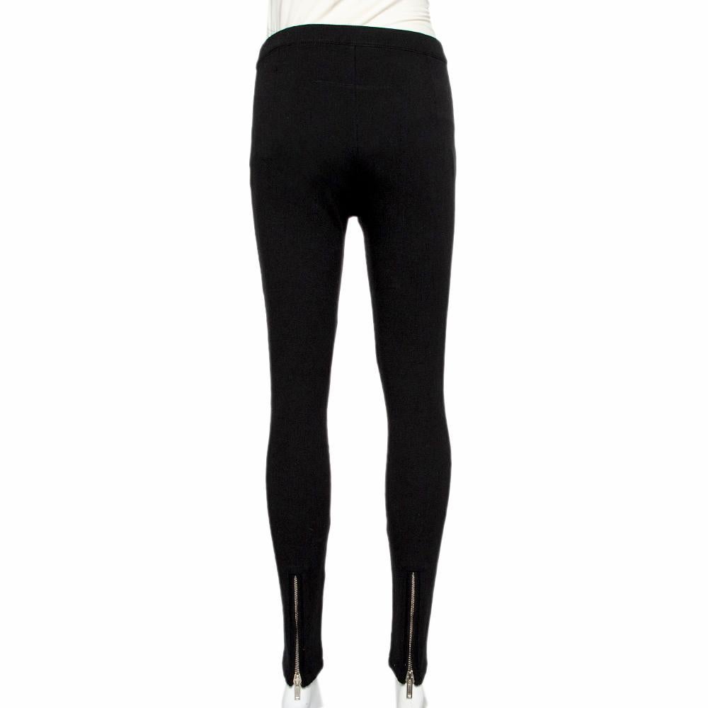 These leggings hail from the house of Givenchy. They have been crafted from knit material and come in a shade of black. They are styled with a side stripe detail and zip closure. The leggings are truly beautiful and will go with a host of tops.

