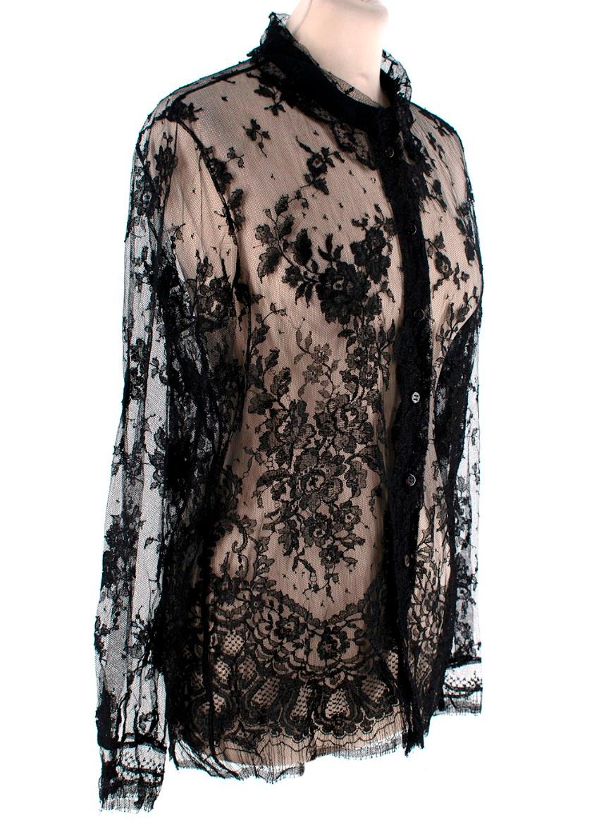 Givenchy Black Lace Sheer Long Sleeve Blouse
 

 - Sheer black lace long sleeve blouse featuring floral motifs
 - Button up closure
 - Button and ruffle finished cuffs
 - Classic collar
 

 Materials:
 The item does not have a care label but we