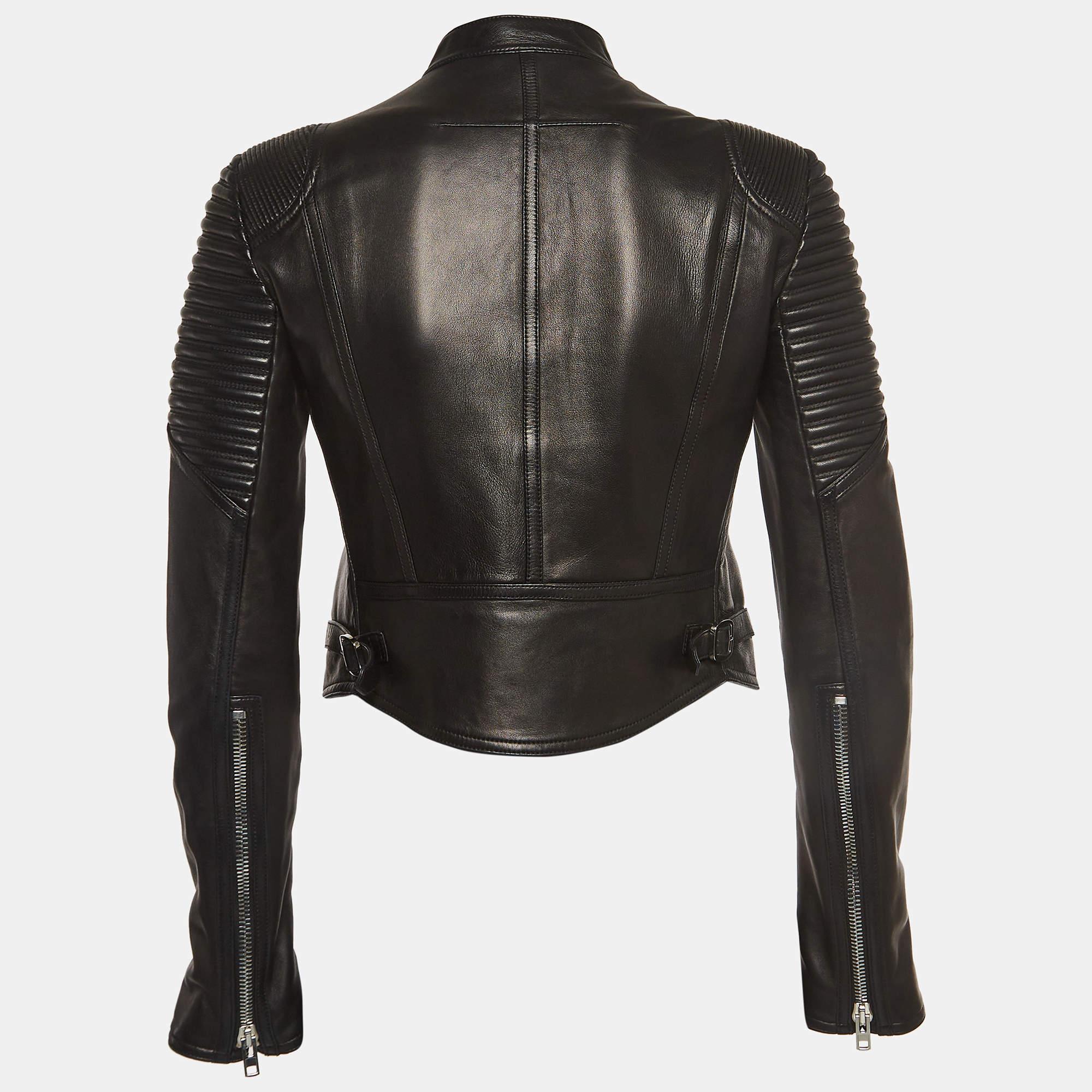 The biker jacket is the epitome of edgy sophistication. Crafted from high-quality lambskin leather, this piece features a sleek, tailored silhouette with zip detailing. Its rebellious charm and timeless appeal make it a must-have addition to any