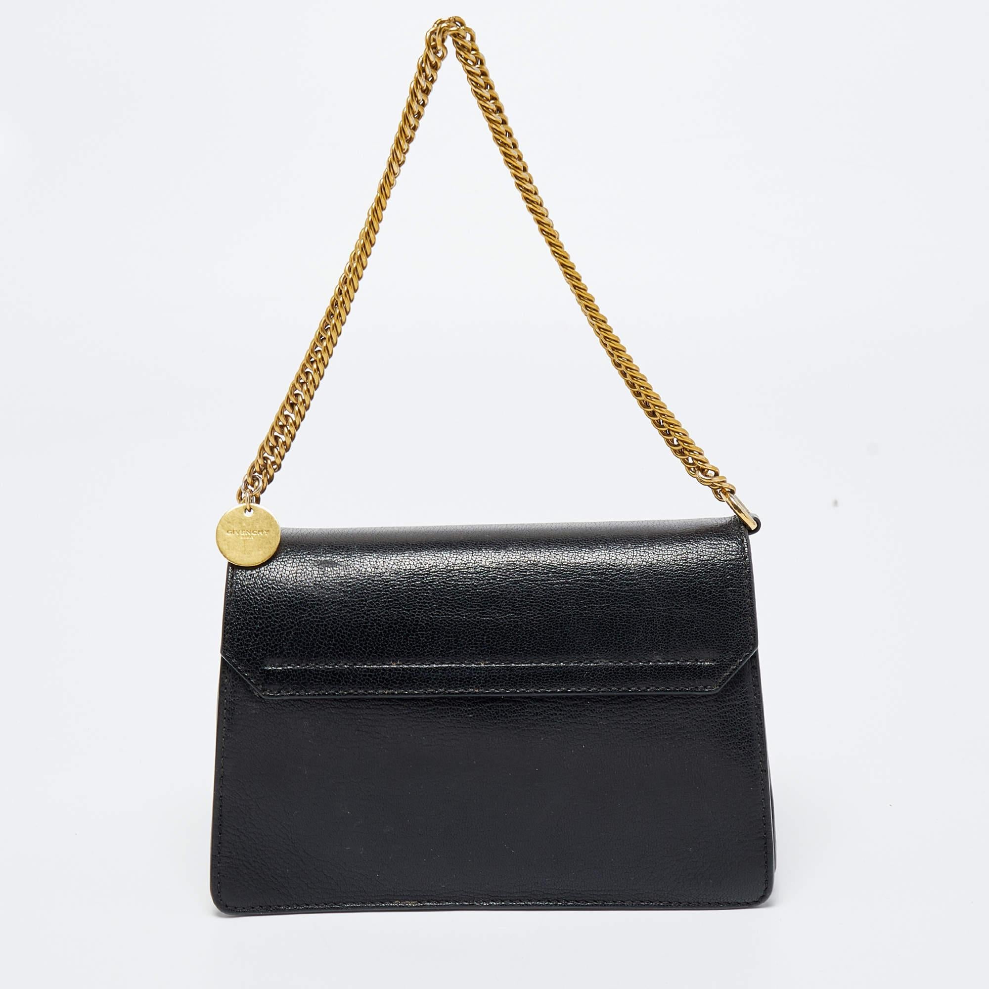This Givenchy shoulder bag showcases the label's classy design attributes. It is made from leather & suede in a classy shade and added with a flap closure, a chain handle, and shoulder strap.

Includes: Original Dustbag, Detachable Strap
