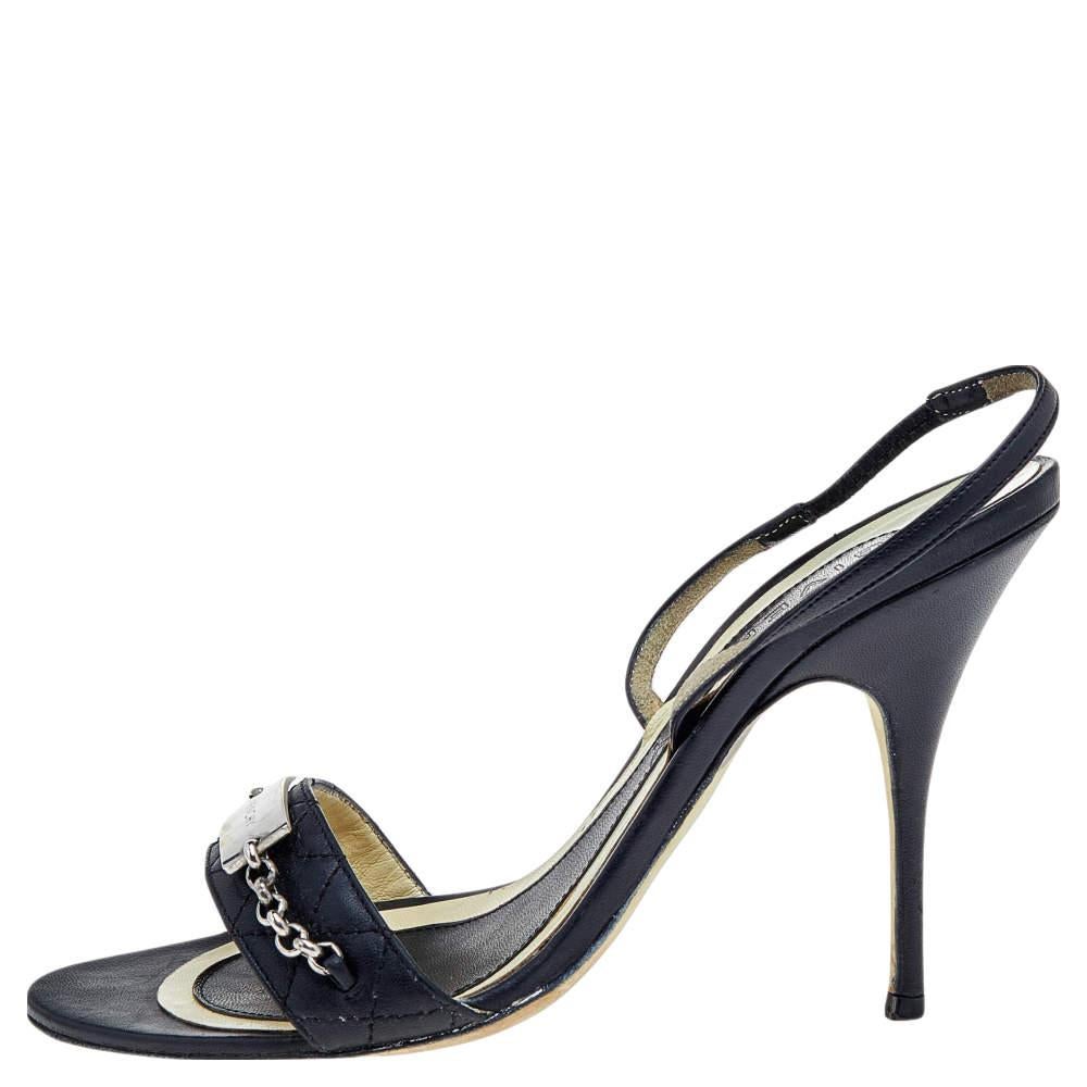 Treat your feet to these chic sandals from the House of Givenchy! They are crafted using black leather on the exterior and detailed with open-toes, silver-toned hardware, and an ankle strap feature. They are completed with slim heels. Match them
