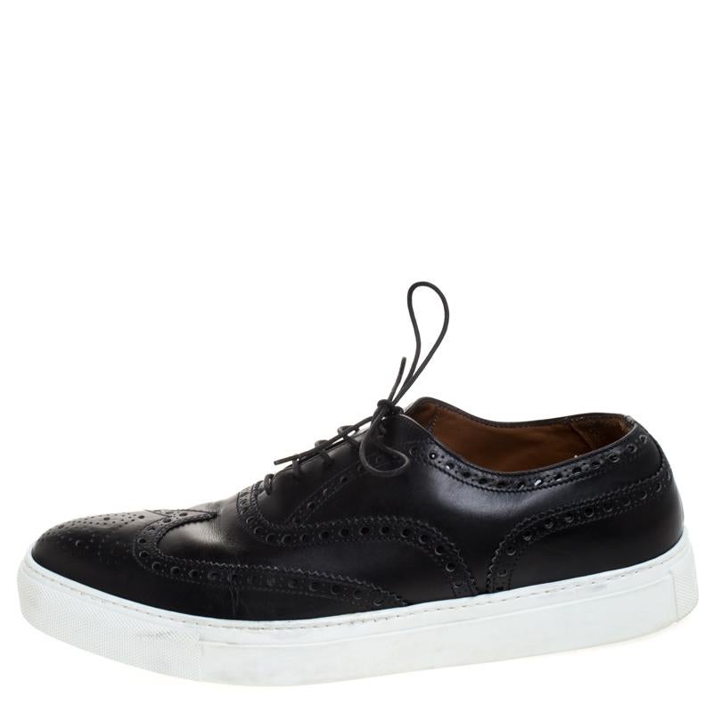How can one not be in awe by just looking at this luxe pair from Givenchy! The black leather sneakers are well-crafted and they are beautified with lace-ups and wingtip detailing. Comfortable insoles and contrasting white platforms complete this