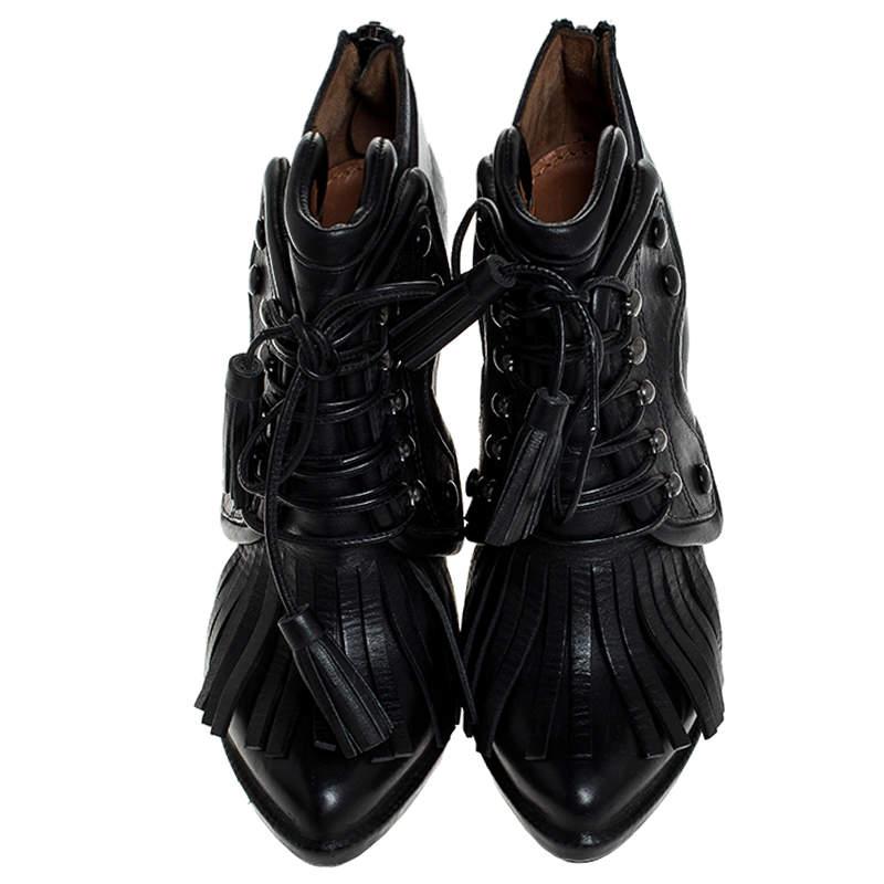 It's time to light all your days with these stylish ankle booties from Givenchy. Modern in design and craftsmanship, these booties are crafted from leather and designed with fringe details, lace-up vamps and slim heels. Pair these beauties with your