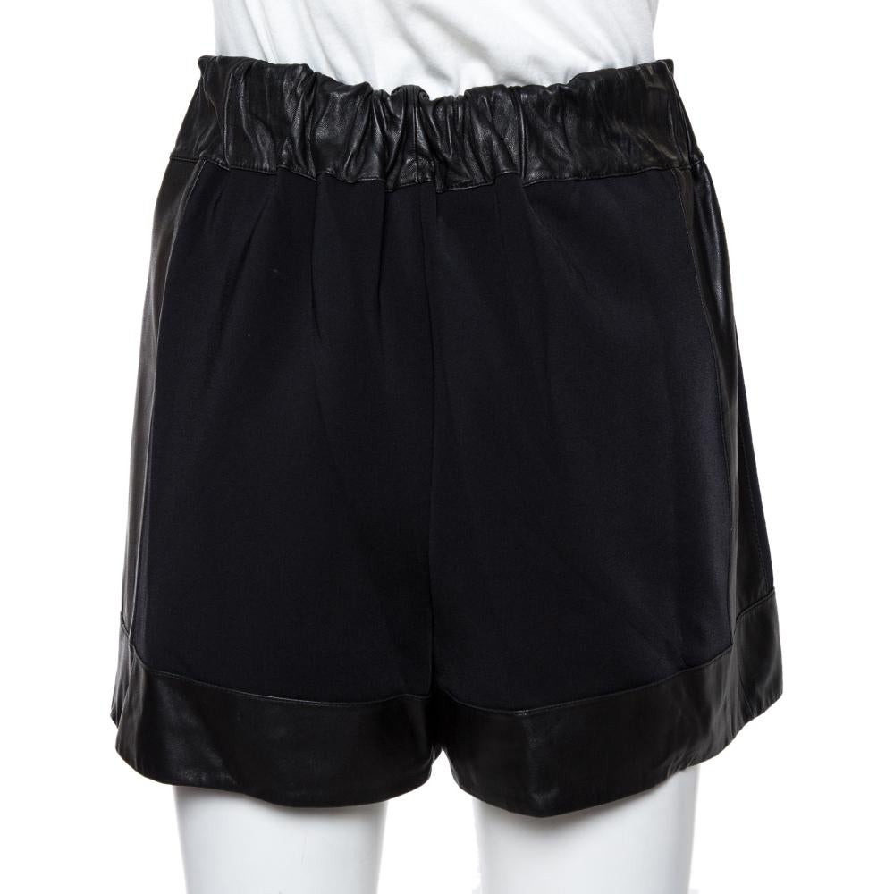 Comfortable and stylish, these Givenchy shorts deserve to be in your closet. Made from jersey and leather, they have a high-waisted silhouette and an elasticized waistband. Tuck in a contrasting printed top and wear chunky sneakers for a chic look.

