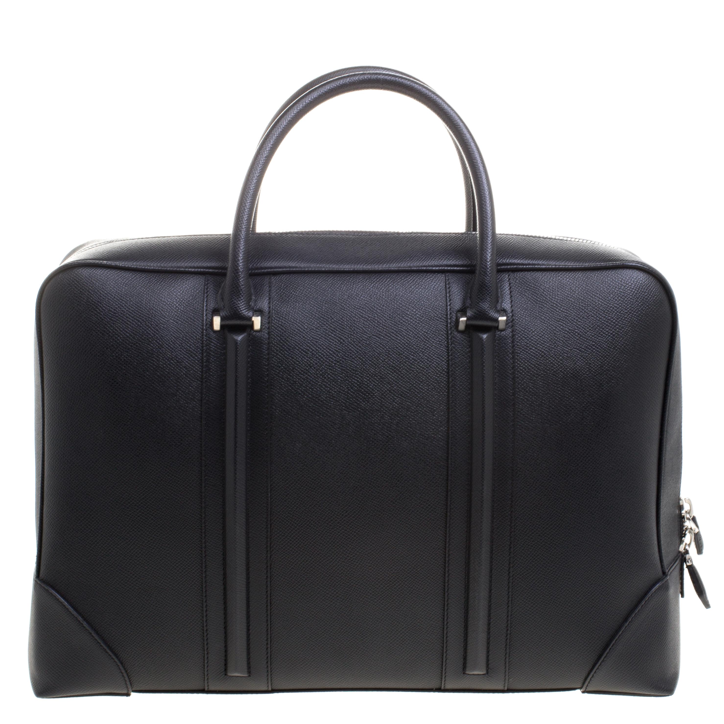 Leather products like this briefcase from Givenchy are not only symbols of style but also reliability. Crafted from leather, this briefcase features two top handles and zippers that open up to reveal a spacious fabric compartment perfectly sized to