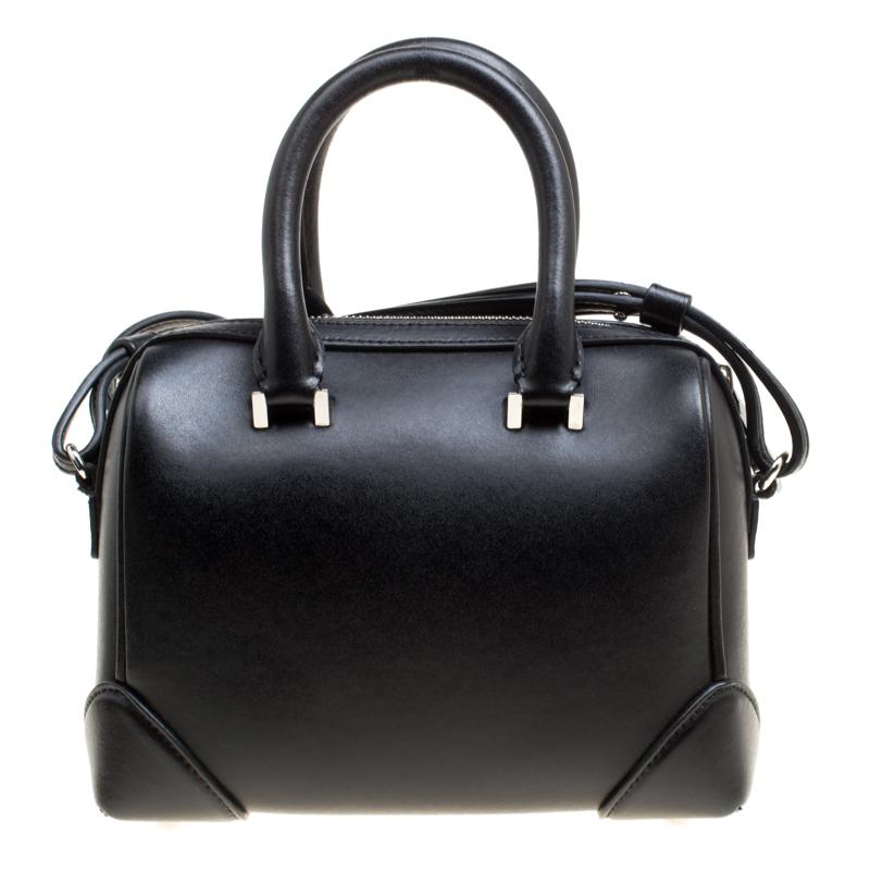 Creations like this Lucrezia Star bowler bag by Givenchy never go out of style. This black bag is crafted from leather and it features dual round handles, a detachable shoulder strap and the top zipper opens to a suede-lined interior spacious enough