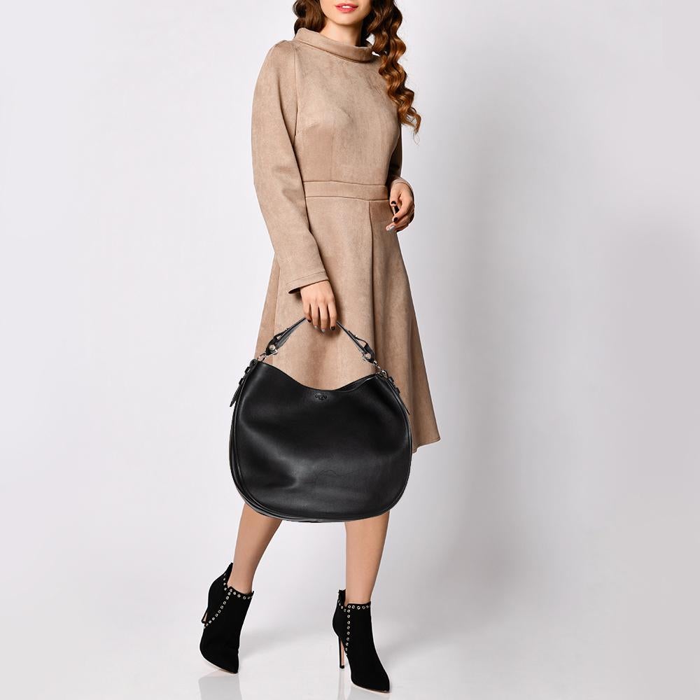 Introduce Givenchy's timeless design aesthetic to your closet with the Obsedia hobo. The Givenchy hobo is crafted from leather and designed with silver-tone hardware and an Alcantara interior secured by a top zipper. It is complete with a single