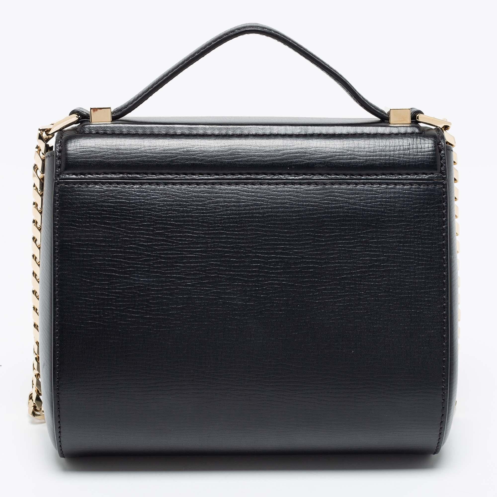 A new spin on Givenchy's original Pandora bag, this Givenchy Mini Pandora Box crossbody bag is crafted from black leather. While the expandable compartment offers plenty of storage for your valuables, the curb-link shoulder strap lends an edgy touch