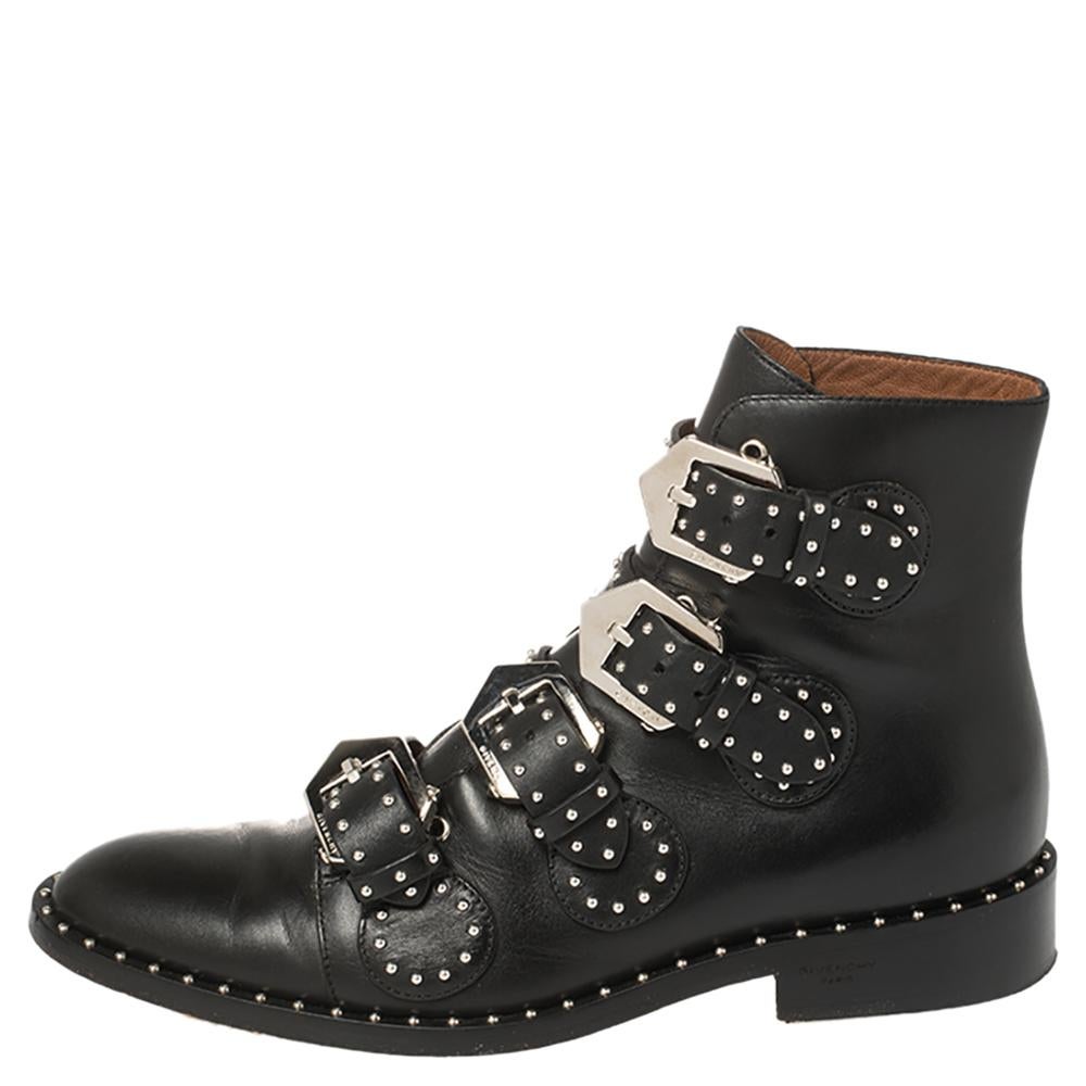 Let this pair of boots accentuate your style this season. Make a bold statement as you flaunt your style with these leather boots from the house of Givenchy. They are styled with buckled belt details and silver-tone studs on the exterior. Complete