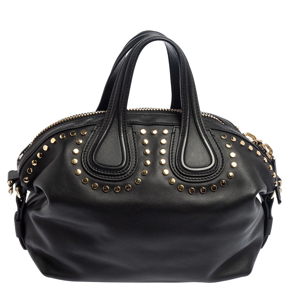 Excellently crafted from black leather for a classy touch, this Nightingale bag from Givenchy is a creation that is ideal for daily use and on your travels. It features stud embellishments, two top handles, a shoulder strap, and a spacious canvas