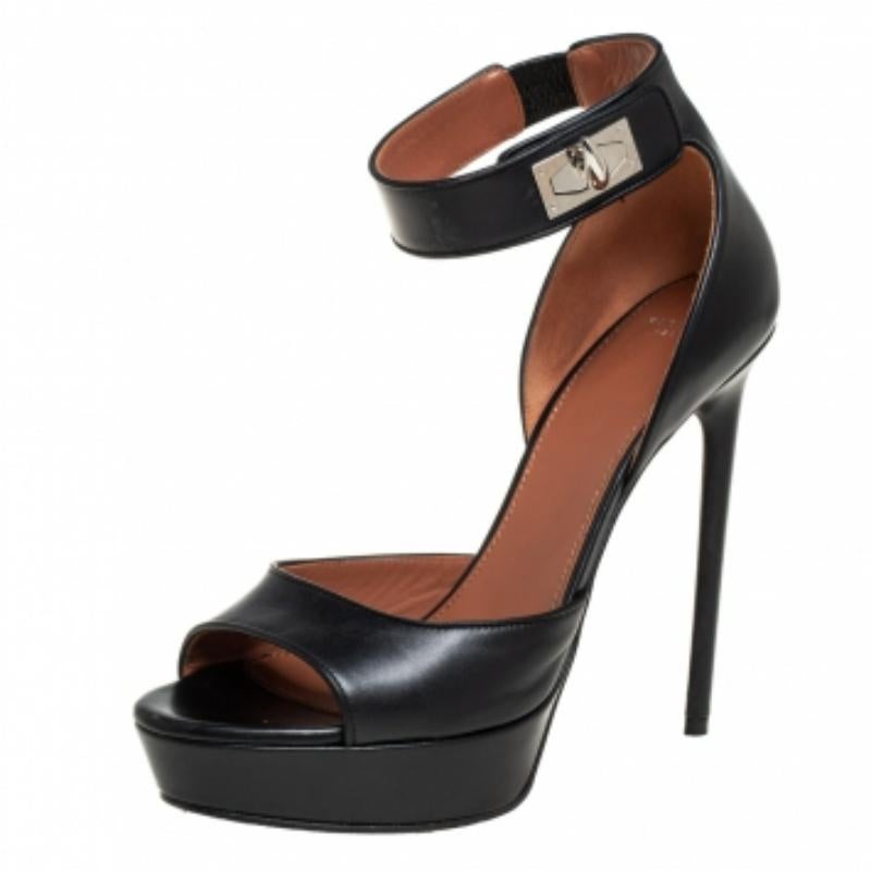 These black sandals from Givenchy are crafted from leather and feature open toes and 13 cm heels. They flaunt ankle straps that are detailed with a silver-tone shark tooth lock. Leather insoles and durable soles offer the right finish.