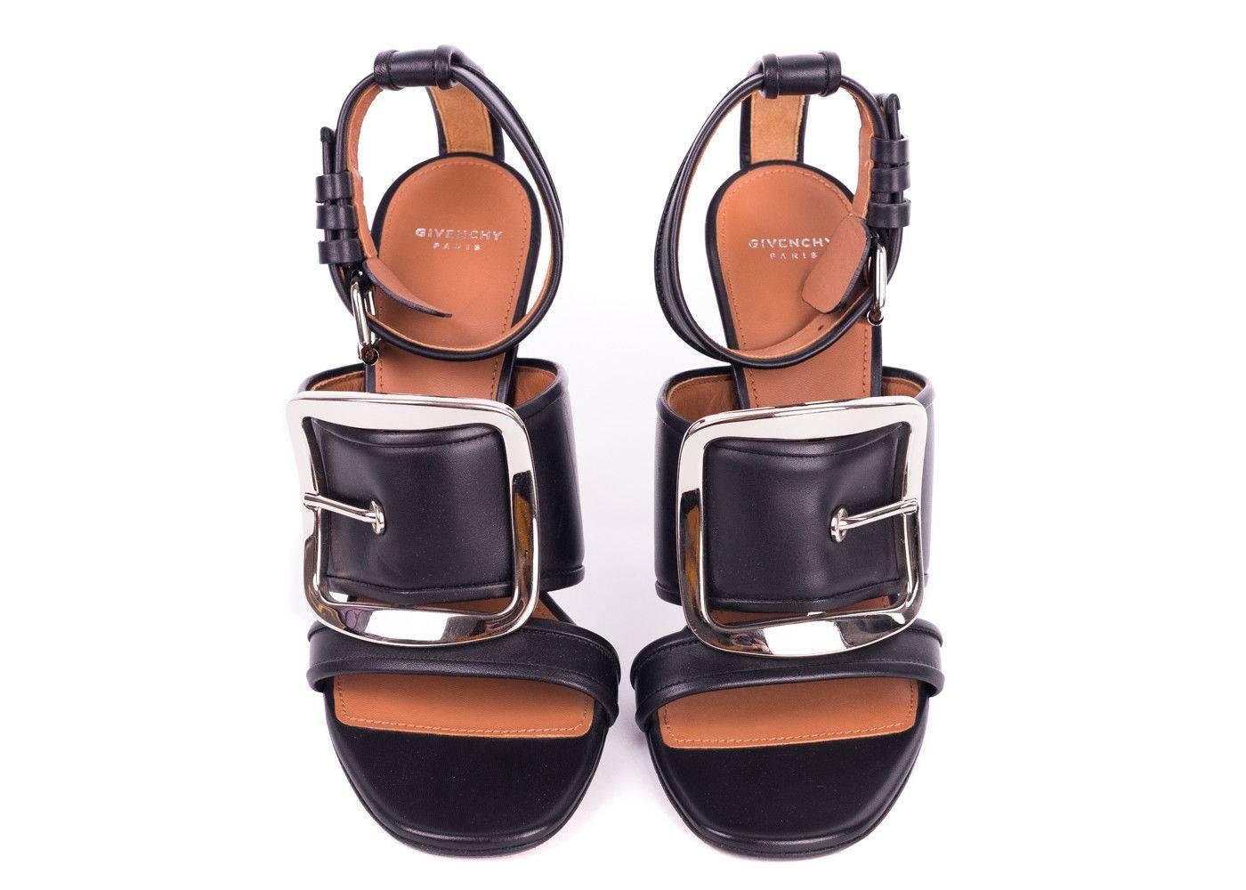 Strut in style with cool-chic elegance courtesy of Givenchy. The Diana Sandal, crafted in Italy of luxe black leather features a large silver tone buckle at center vamp with an edgy ankle strap. This style is versatile enough to go from reserved day