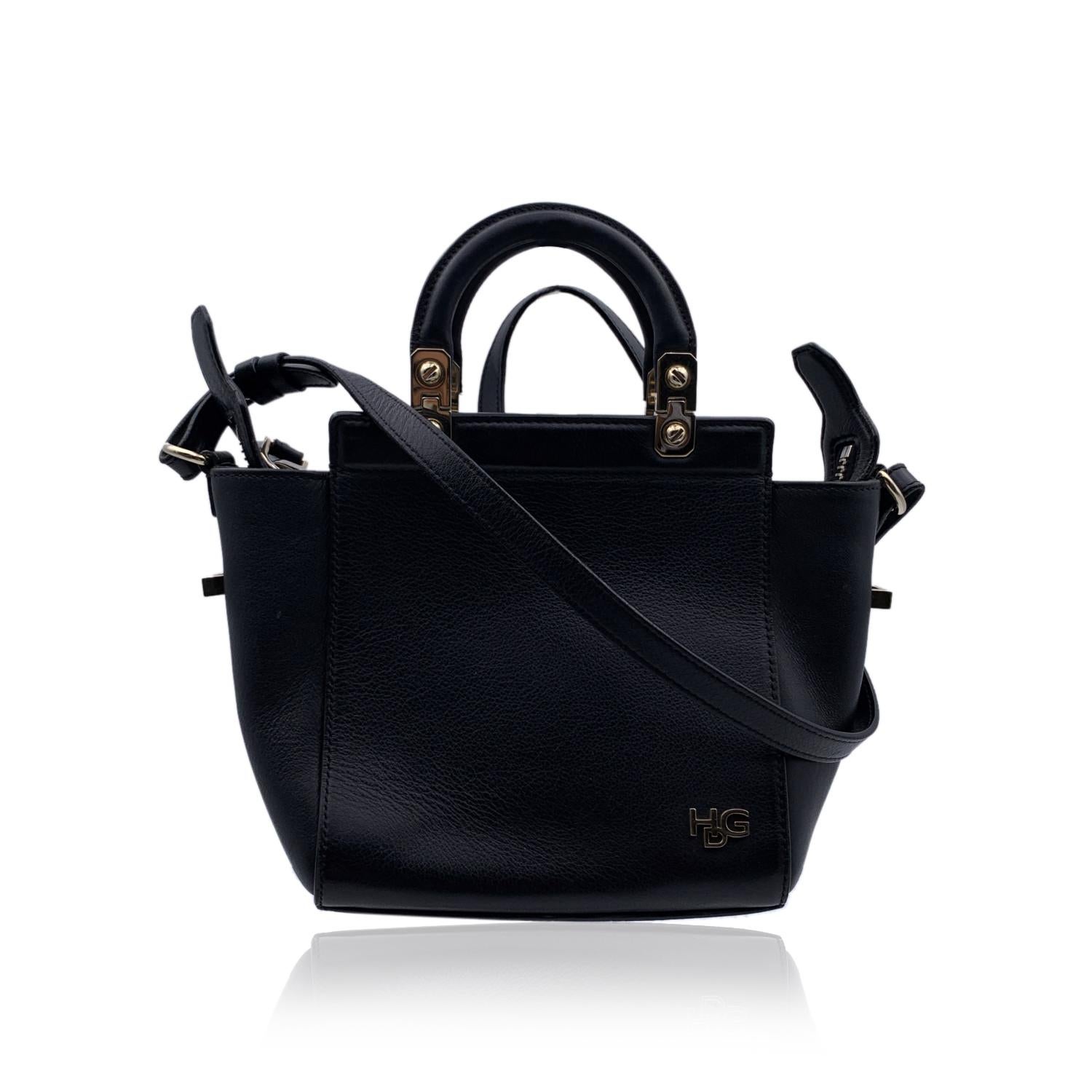 Givenchy 'HDG Small Tote' bag with shoulder strap. Black leather and light gold metal hardware. Double top handles and removable shoulder strap. Upper zipper closure. Black microfiber lining. 'Givenchy - Made in Italy' tag