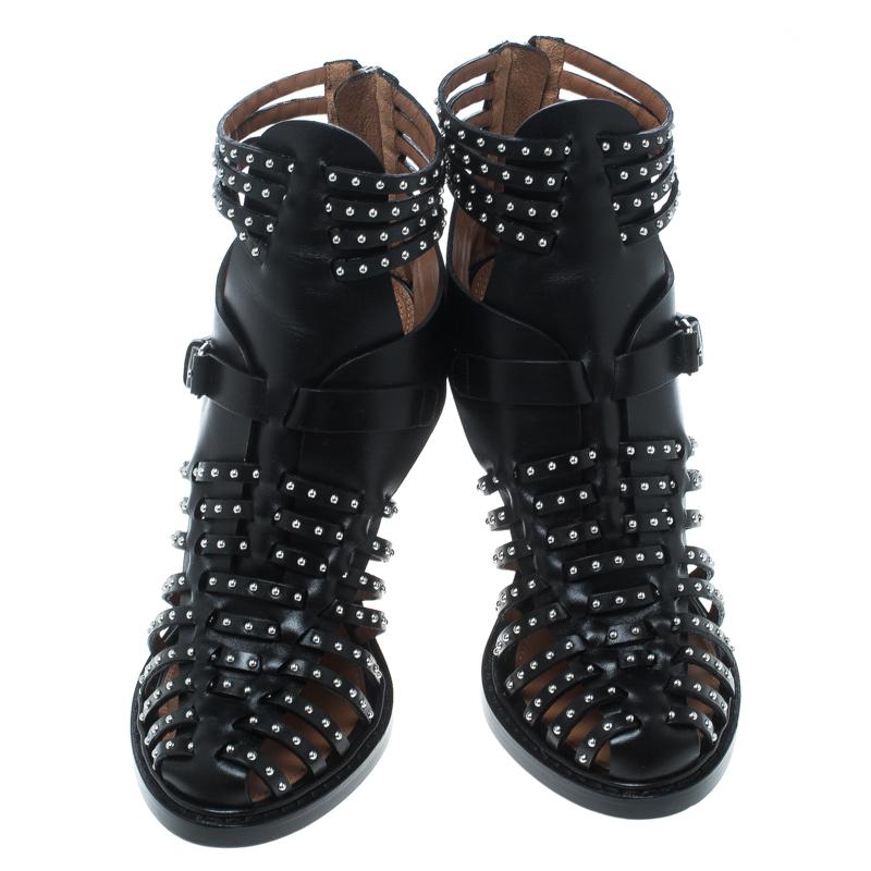 These black gladiator sandals from Givenchy are very chic and stylish! They are crafted from leather and feature a cage design with multiple straps that are adorned with silver-tone studs. They also flaunt buckled straps, back zippers, comfortable