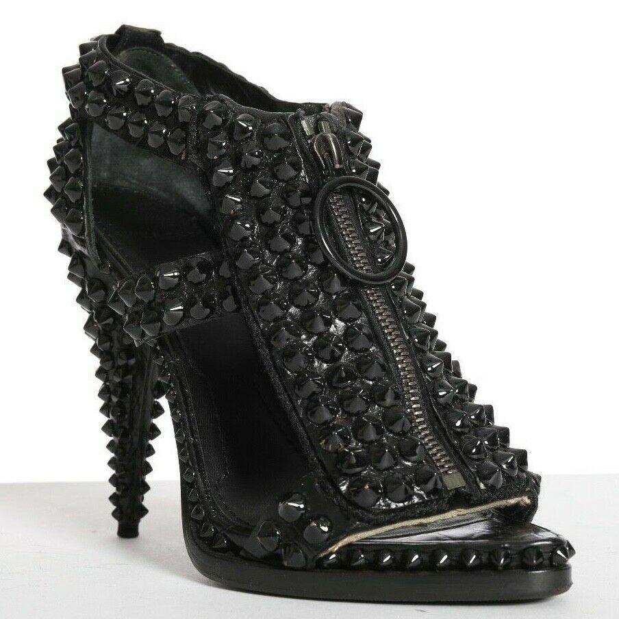 GIVENCHY black leather studded zip front sandals heels EU37.5 US7.5 UK4.5
GIVENCHY by RICCARDO TISCI
Black textured leather upper . 
Fully studded in tonal black studs throughout . 
Zip front with loop zipper pull . 
Open toe . 
Pointed footbed .
