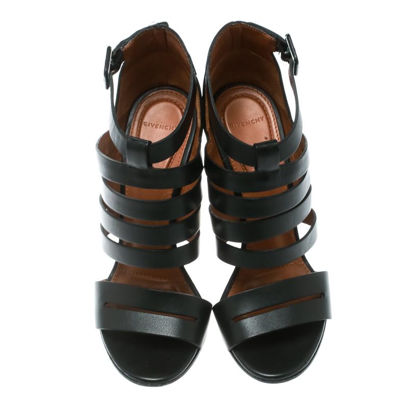 Aren't these sandals from Givenchy simply amazing! The black sandals are crafted from leather and feature an open toe silhouette. They flaunt a cage design on the vamps and come equipped with buckled ankle straps, comfortable insoles and 10.5 cm