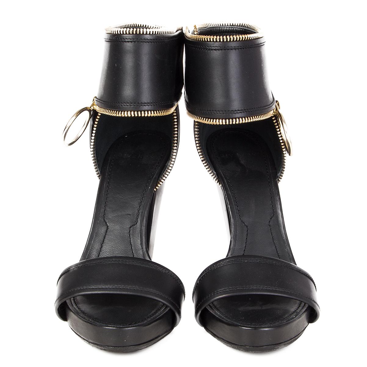 100% authentic Givenchy ankle-strap platform sandals feature a single band at the vamp and elastic double-snap closure at the ankle. Gold-tone metal ring pull and zipper detail at the ankle strap. Have been worn and are in excellent condition. Black