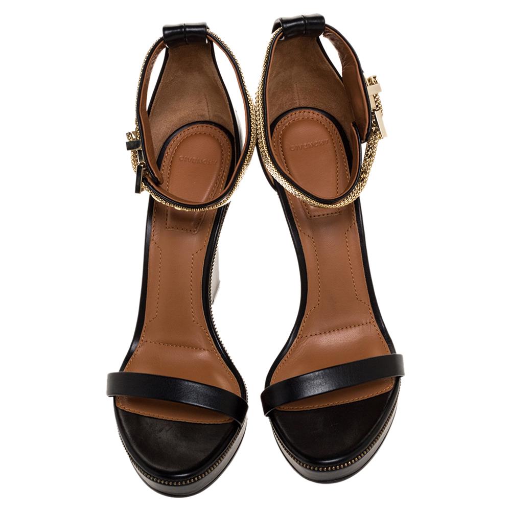 Exuding beauty in true luxury style are these sandals from the house of Givenchy! They've been crafted from leather and designed with distinct ankle straps, zipper trims, 12 cm wedge heels, and open toes. You will love owning them.

Includes: