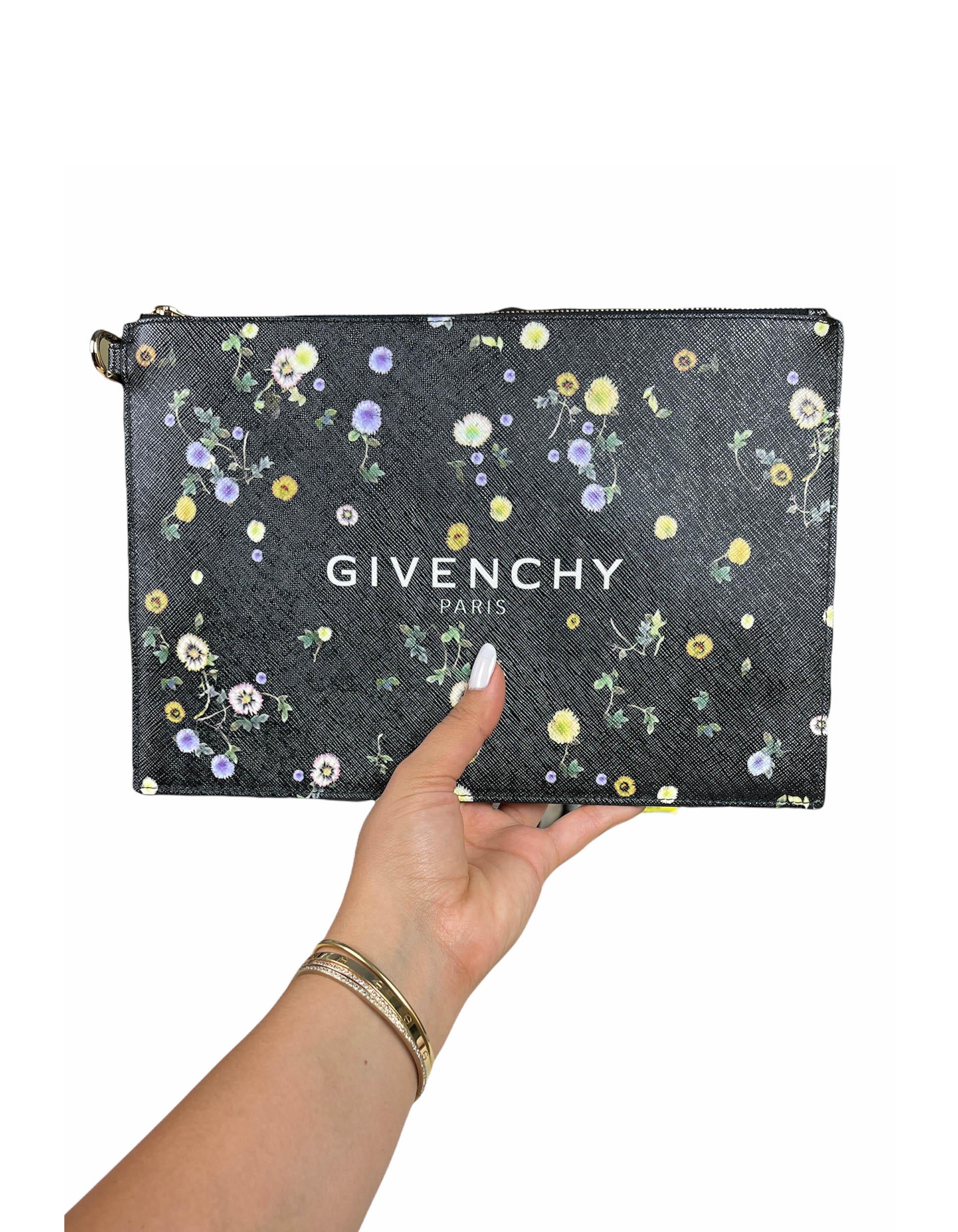 Givenchy Black Leather Floral Printed Logo Large Pouch Bag

Made In: Italy
Year of Production: 2019
Color: Black and multicolor
Hardware: Goldtone
Materials: Grained leather
Lining: Black textile
Closure/Opening: Zip top
Interior Pockets: One flat