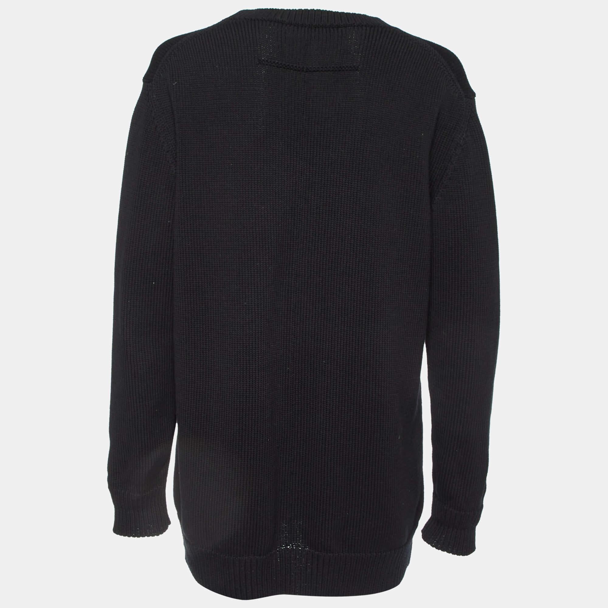 Wrap yourself in warmth and style with this Givenchy black sweater. Meticulously crafted for comfort and fashion it epitomizes timeless sophistication. Each stitch reflects quality making it an essential piece for every wardrobe.