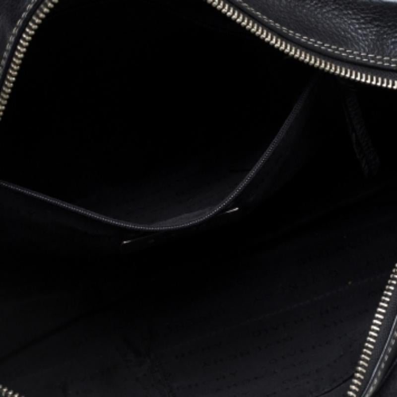 Stunning in appeal and high on style, this Givenchy satchel has been crafted from monogram canvas and leather and designed minimally with silver-tone hardware and contrasting stitch details. It comes with dual top handles and the brand logo plaque