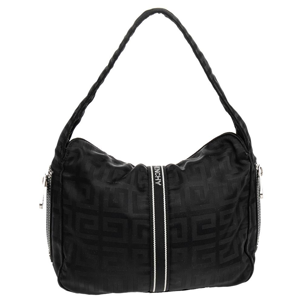 Edgy and quite different, this hobo from Givenchy definitely needs to be on your wishlist. The classic black hobo is crafted from nylon and spells creative excellence. It features a single strap, silver-tone zip closures at the sides, and a metal