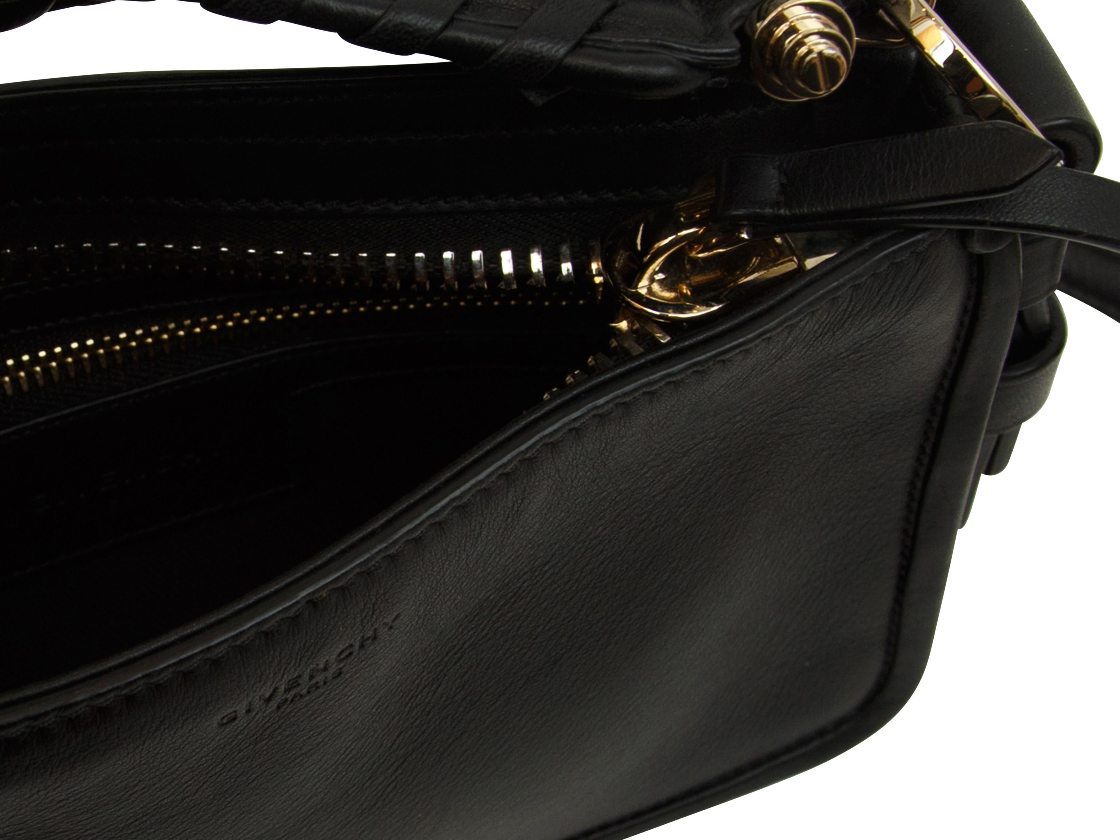 Product details:   Givenchy's Obsidia Clutch in Black can be worn as a clutch bag; simply carry it by the top handle. Change the look by using the shoulder strap and dangle it from your shoulder. The bag has a top zippered closure, the top handle is