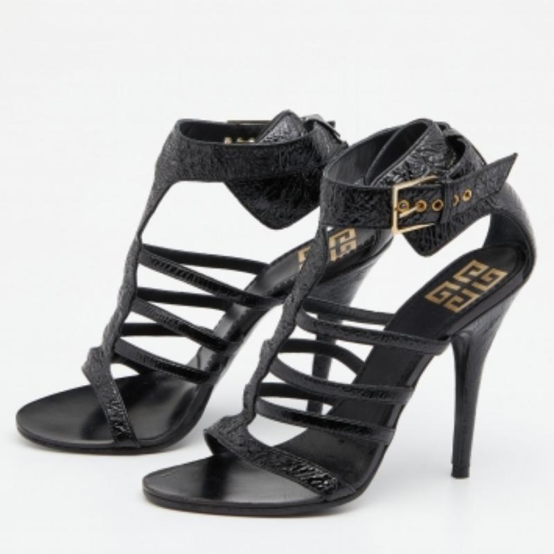 These Givenchy sandals have the perfect blend of contemporary elegance. A caged silhouette, gold-tone hardware, and an ankle buckle closure elevate the pair's minimalist construction. Made from patent leather, it will perfectly complement most
