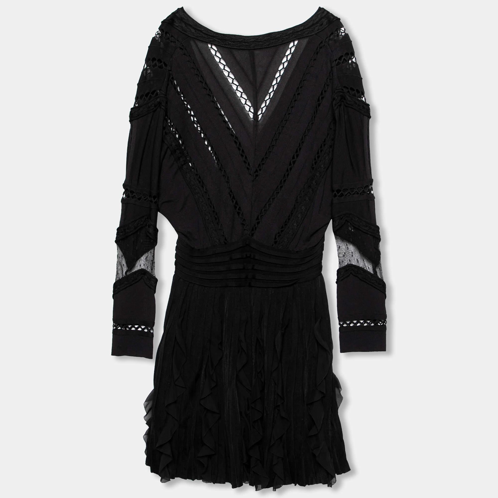 Make room in your closet for this lovely black dress from Givenchy. It is made from a fine blend of materials and features a patterned knit style finished with pretty ruffle detailing. Pair it with high heels and hoop earrings for an elegant appeal.