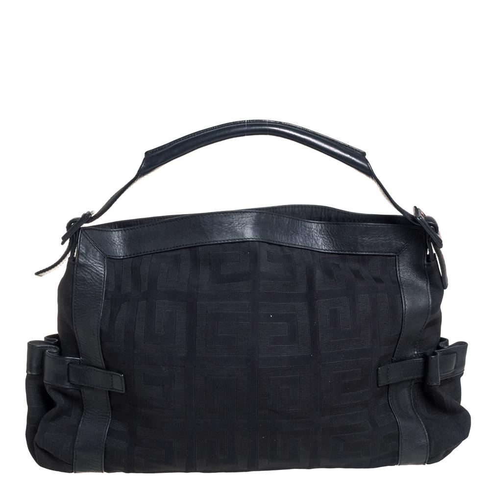 This black satchel from Givenchy will give you days of style and ease. It is crafted from the signature canvas and leather and features gold-tone hardware. It is equipped with a spacious fabric interior and a single top handle and it flaunts an