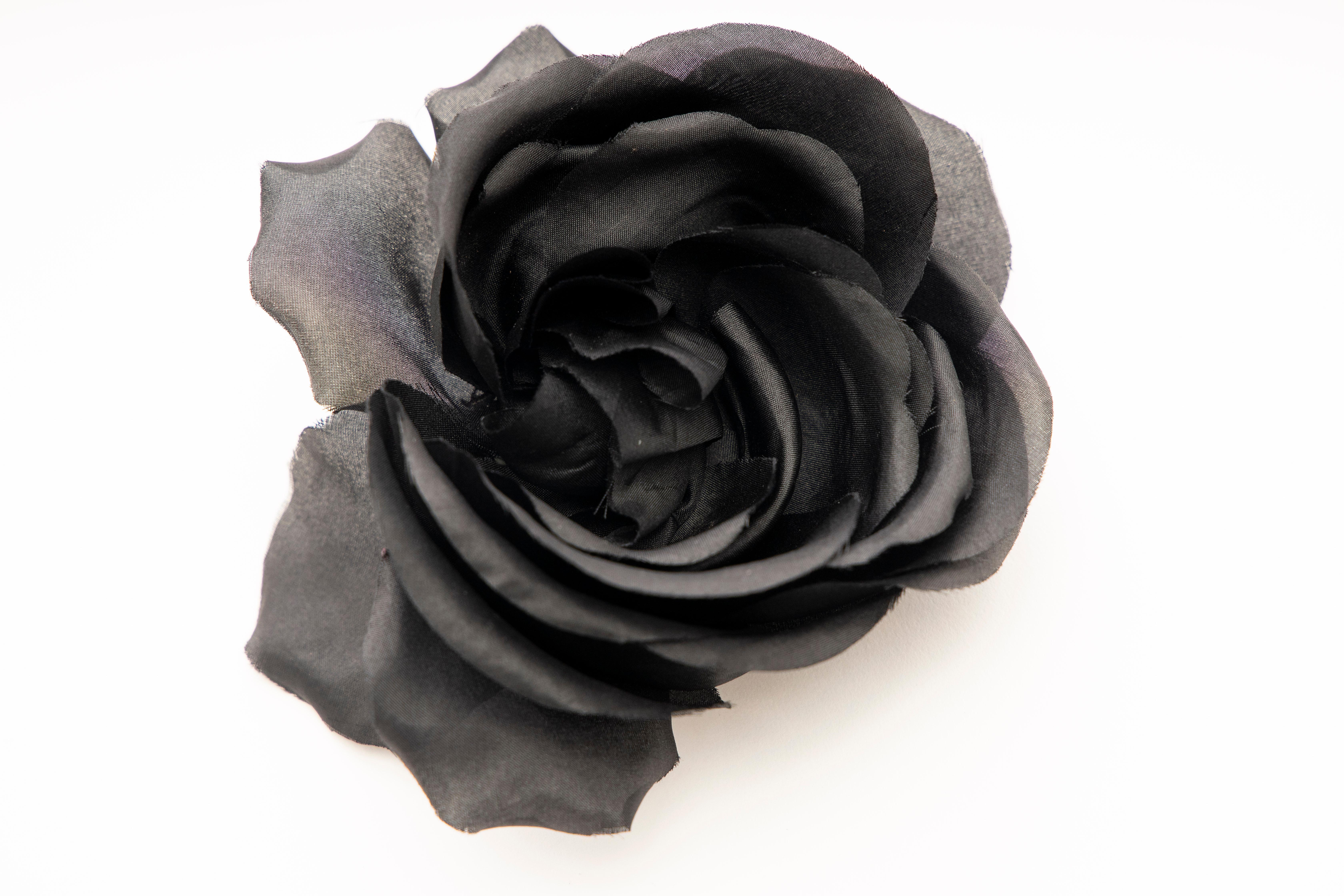 Givenchy, Circa: 1960's black silk flower hair comb.

Length: 4, Width: 4.25
