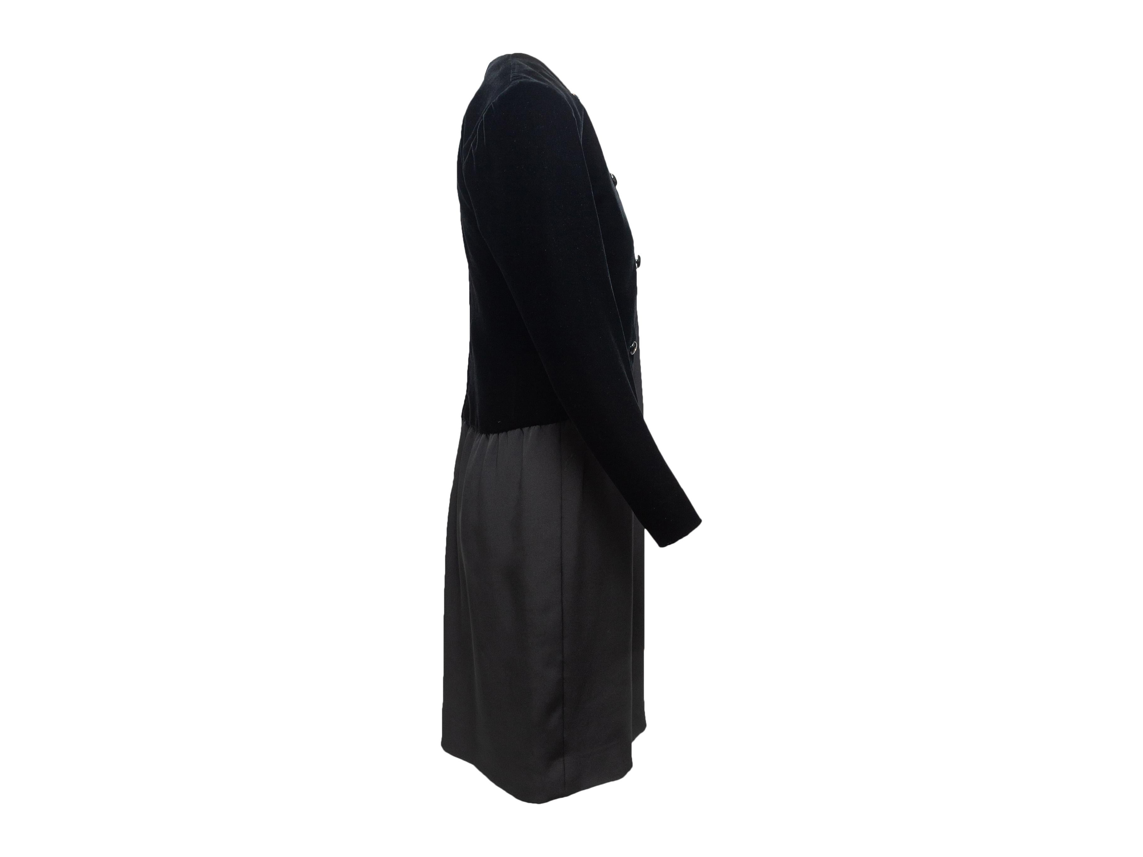 Product details: Vintage black silk and velvet dress by Givenchy. Long sleeves. Crew neckline. Button accents at front. Zip closure at center back. Designer size 38. 34
