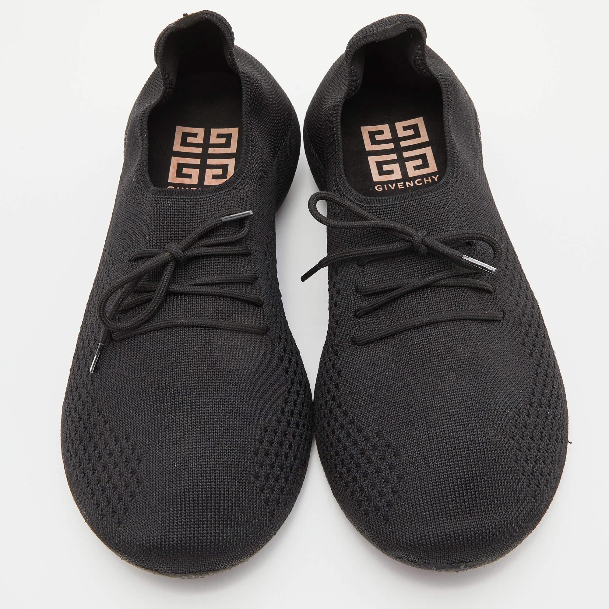 The Givenchy Knit TK-360 sneakers are a stylish and comfortable footwear option. Crafted with precision, they feature a stretchable black knit upper that adapts to the foot's shape, providing a snug fit. These sneakers boast a contemporary design
