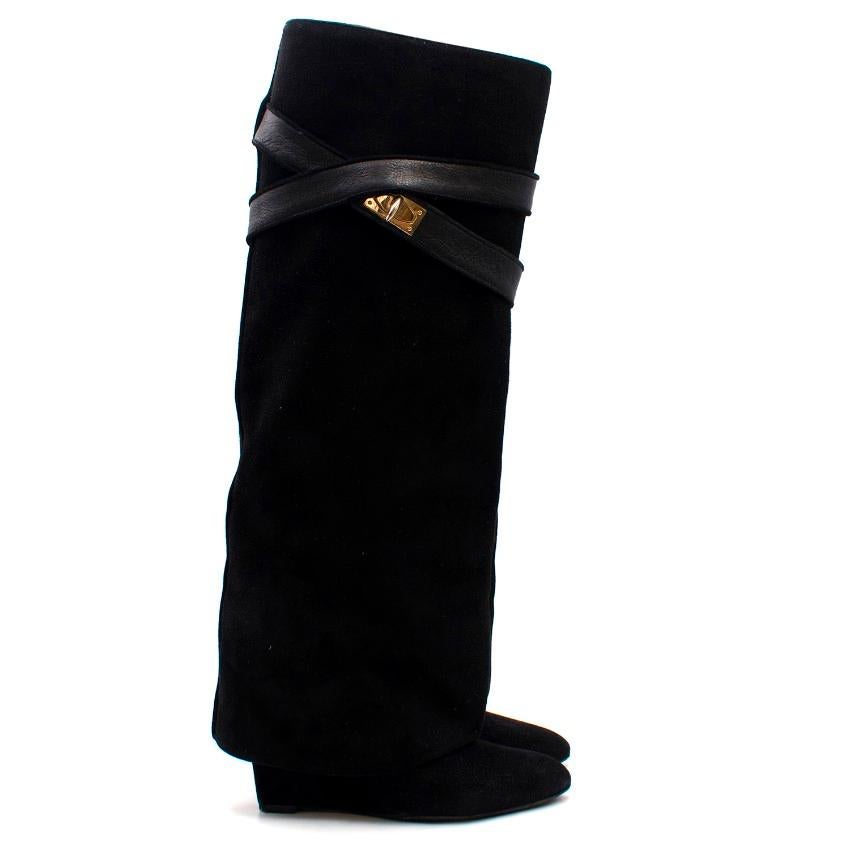 Givenchy Black Suede Shark Lock Boots

-Black knee high wedge boots
-Oversized suede cover
-Leather strap with clasp
-Gold toned shark tooth clasp
-Pointed toe

Please note, these items are pre-owned and may show signs of being stored even when