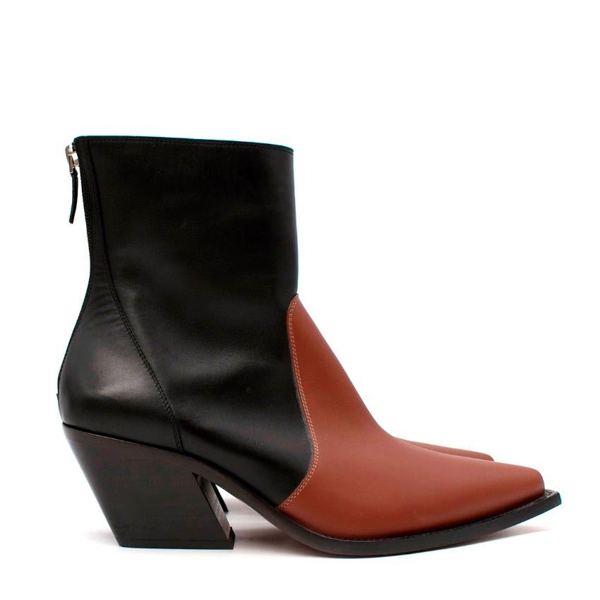 Givenchy Black & Tan Leather Western Ankle Boots
 

 - Minimally chic, western inspired ankle boots by Givenchy, featuring contrasting deep tan toe cap on a black smooth leather body
 - Point toe, with squared off chunky sole tip giving a modern