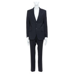 Traje pantalón de GIVENCHY, de lana virgen negra, de corte entallado, con dos botones y corte de un solo pecho, talla FR46 S