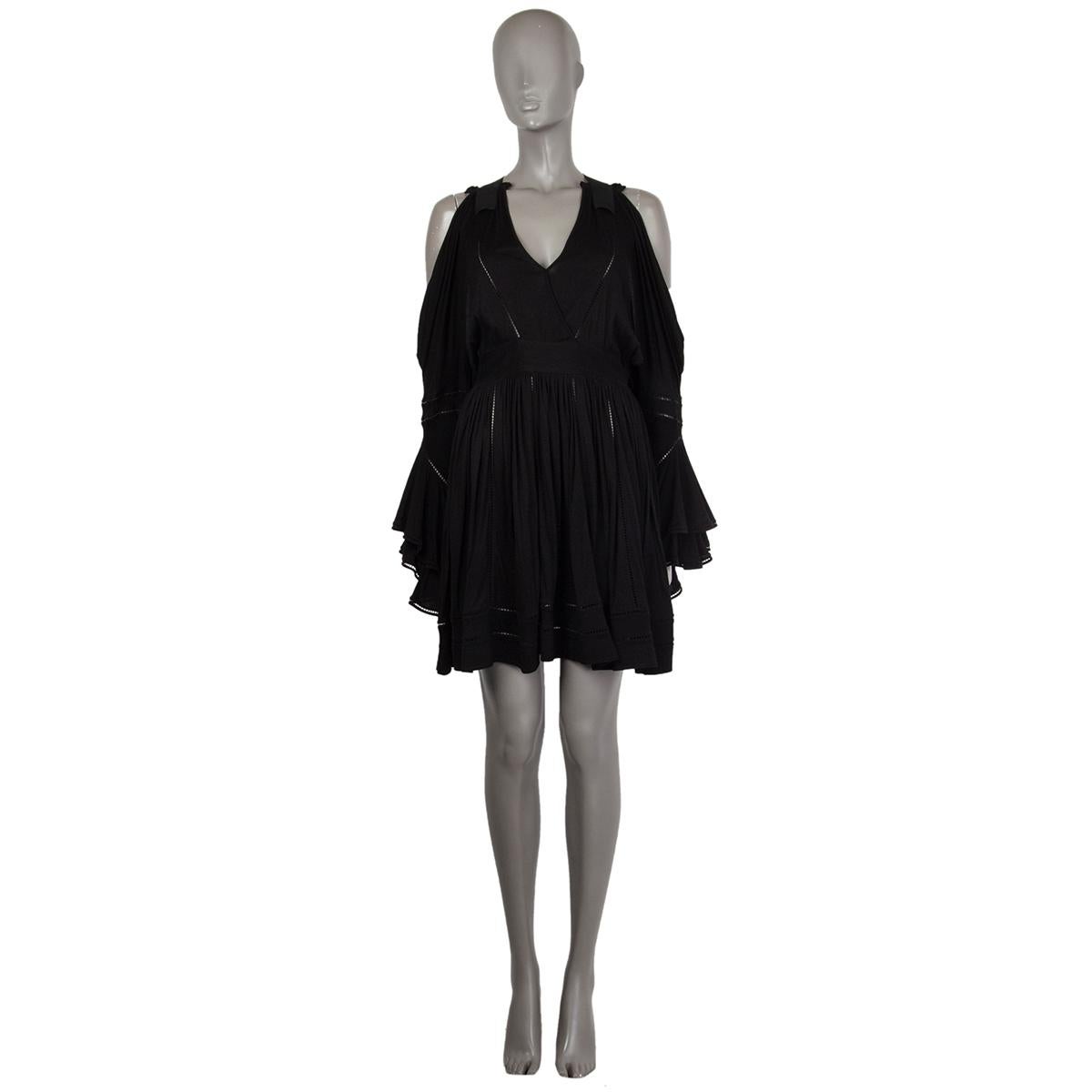 100% authentic Givenchy jersey mini dress in black viscose (81%) and silk (19%). With cutout shoulders, v neck, racer back, empire waist, and ruffled sleeves. Closes with hook and invisible zipper on the side. Unlined. Has been worn and is in