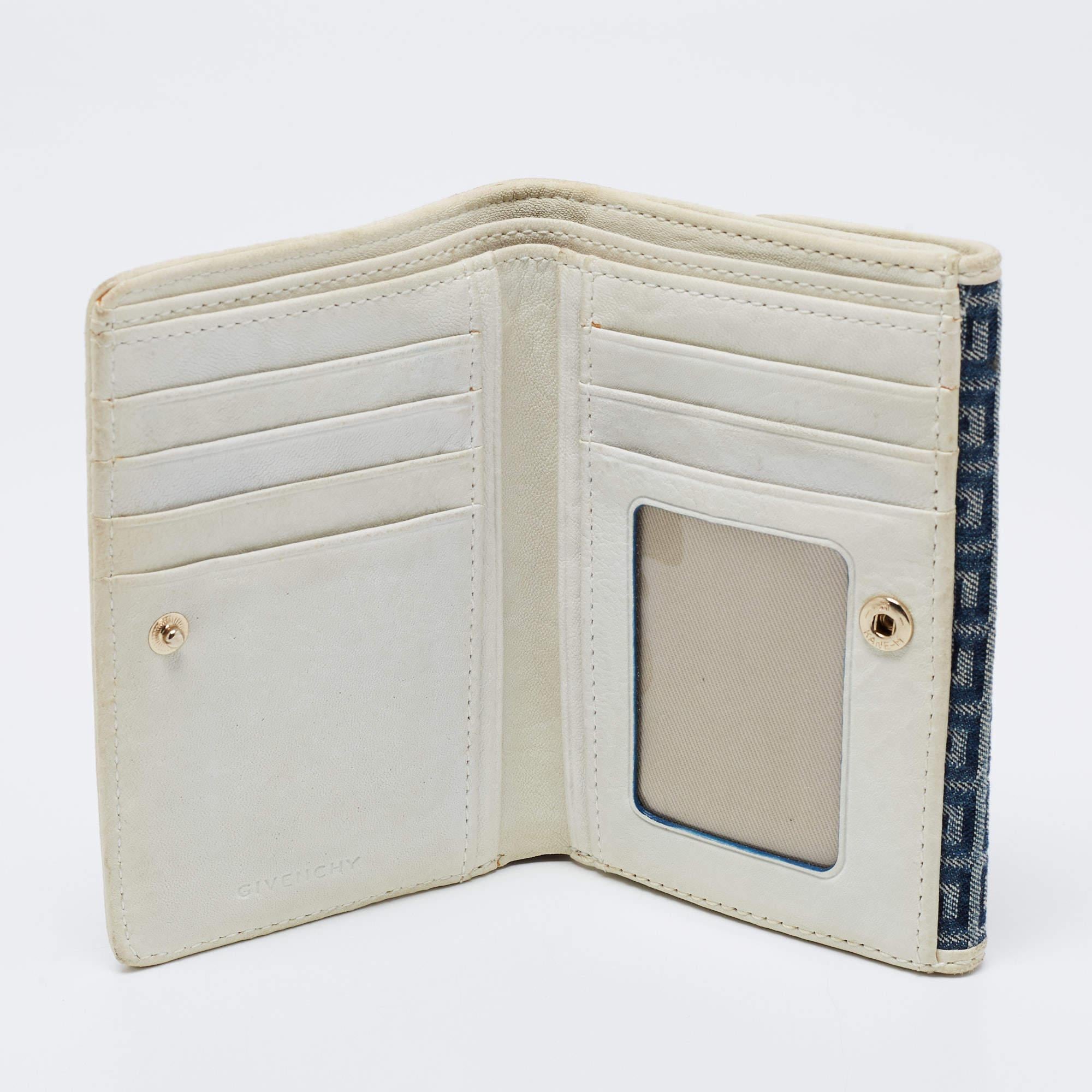 Keep your monetary essentials in an organized way with this compact wallet from the House of Givenchy. It is made from blue cream Monogram canvas and leather with gold tone hardware elevating its beauty. It opens to a spacious interior.