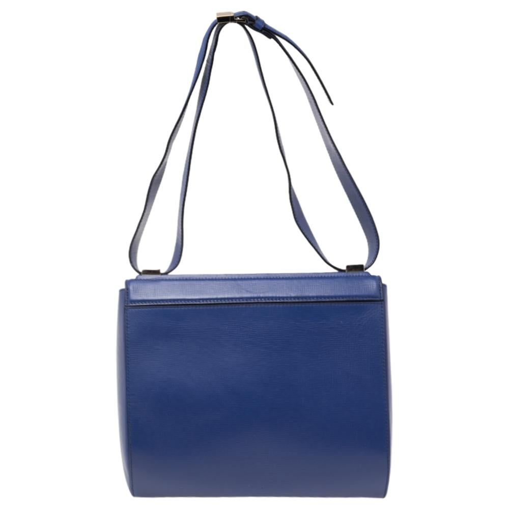 This Givenchy Pandora box bag is crafted in blue-hued leather and features an adjustable shoulder strap. With an eye-catching silhouette and a zipper at the front, the flap opens to a smooth Alcantara-lined interior that offers enough space to hold