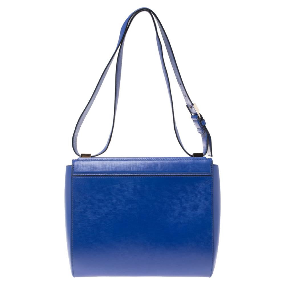 Givenchy brings us this well-shaped shoulder bag that has been crafted from blue leather and designed with a flap and a suede interior for your belongings. The bag is complete with a long shoulder strap and a zip detail.

Includes: Price Tag, Info