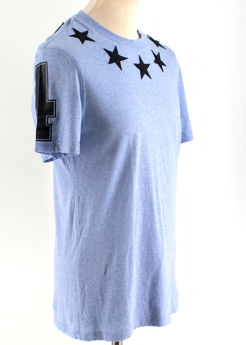 Givenchy Blue Stars #74 Jersey T-shirt

- Blue cotton T-shirt
- Jersey style
- Round neckline
- Star embellishment to the neckline 
- #74 embellishment to the sleeves

Please note, these items are pre-owned and may show some signs of storage, even