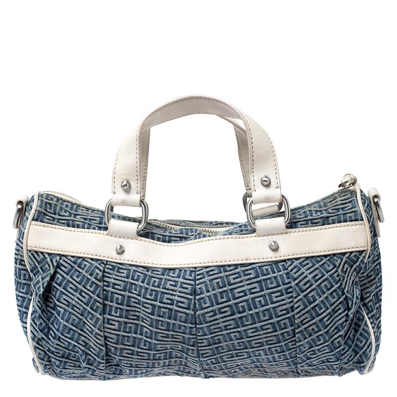 This fashionable bag by Givenchy will effortlessly complement a daytime look. It is crafted from logo-printed blue denim with contrasting white leather trims. It is finished with a Givenchy logo plate at the front, a top zip closure, silver-tone