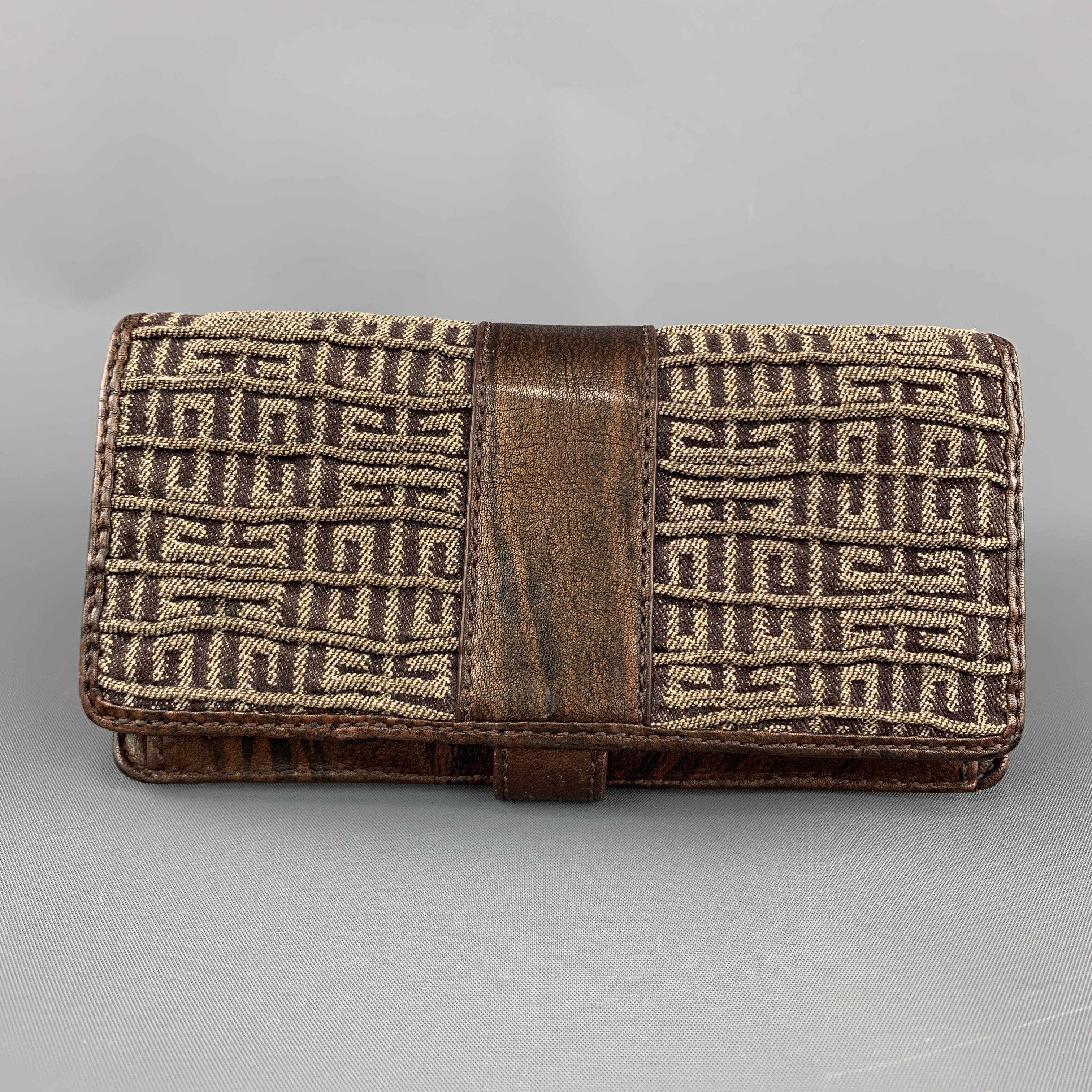 GIVENCHY bifold wallet comes in gathered GG monogram sparkly gold canvas with brown leather piping, snap strap closure with gold tone hoop, and brown leather interior storage. 

Excellent Pre-Owned Condition.

Measurements:

Length: 7.75 in.
Width: